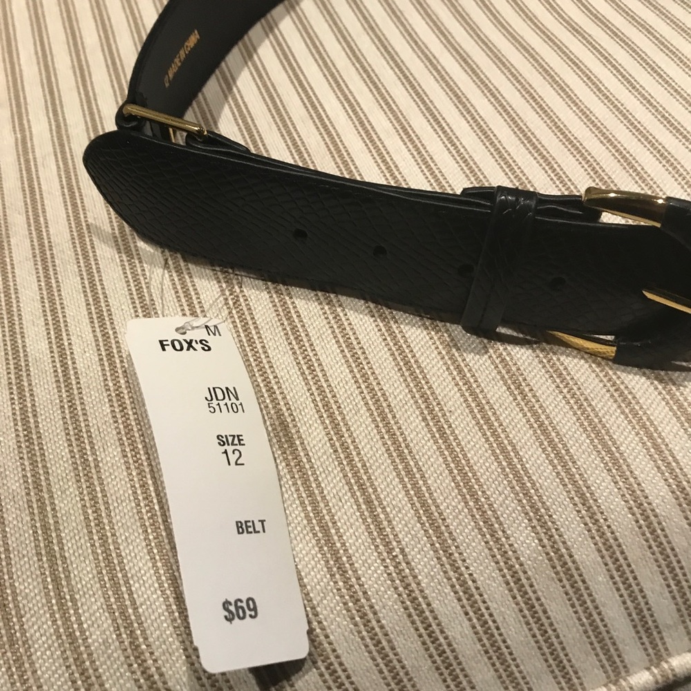 Black belt with gold buckle and detailing
